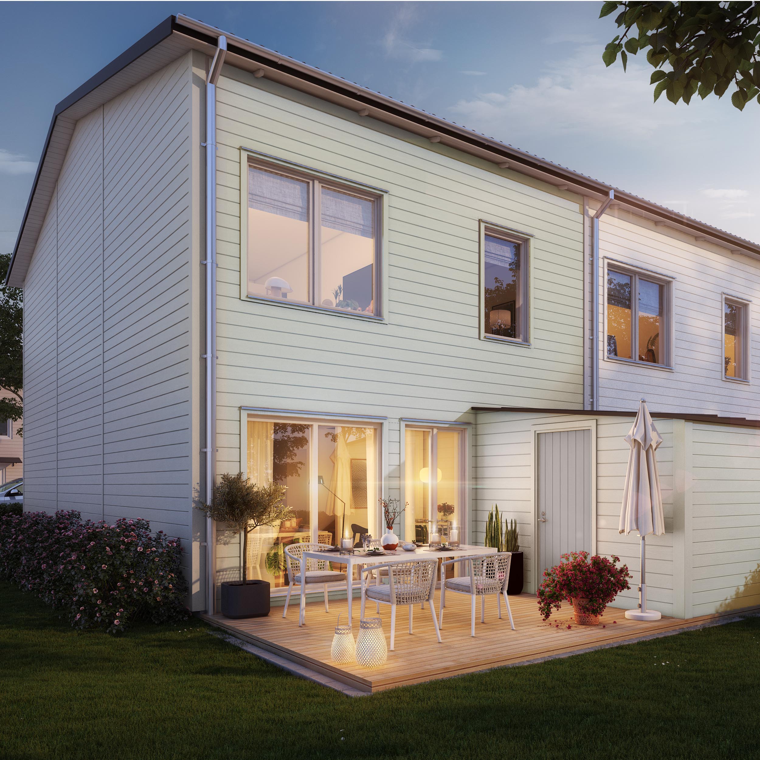 Ett vitt radhus en skön sommarkväll